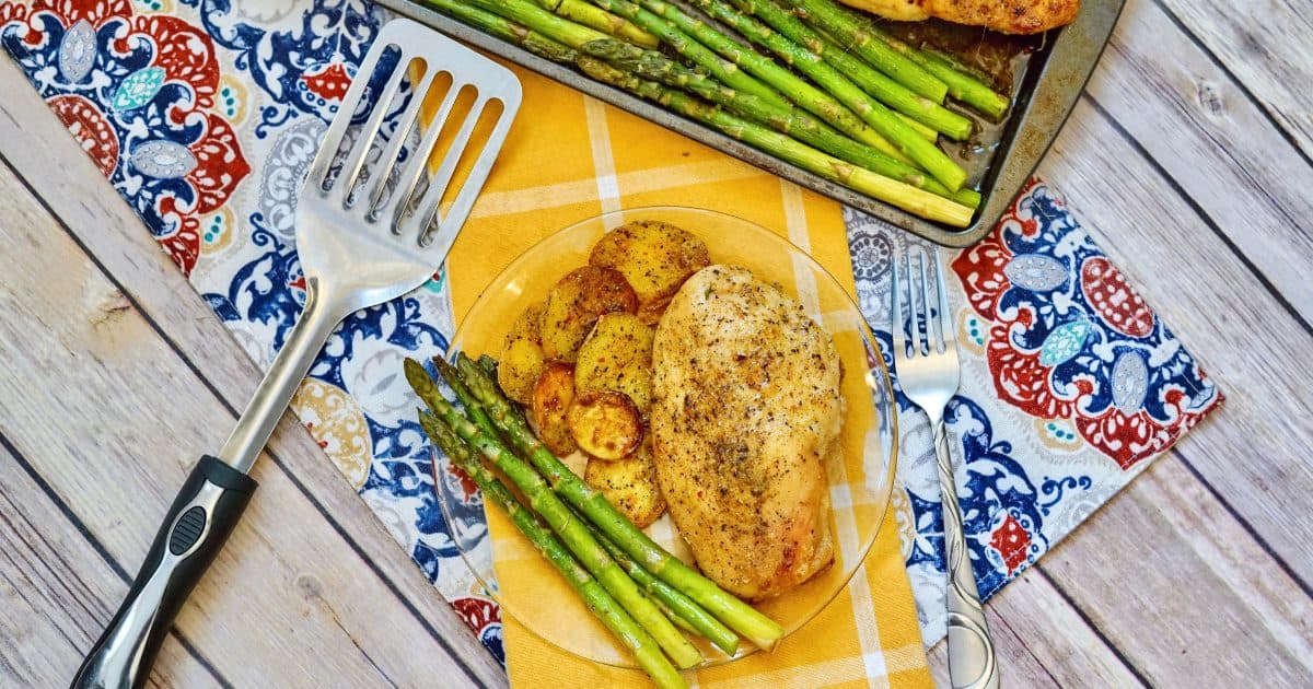 baked italian chicken and veggies on plate on decorated table
