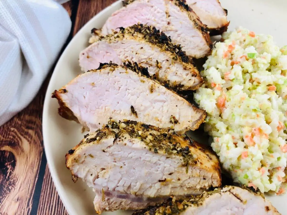 Air Fryer Pork Tenderloin on a plate with slaw