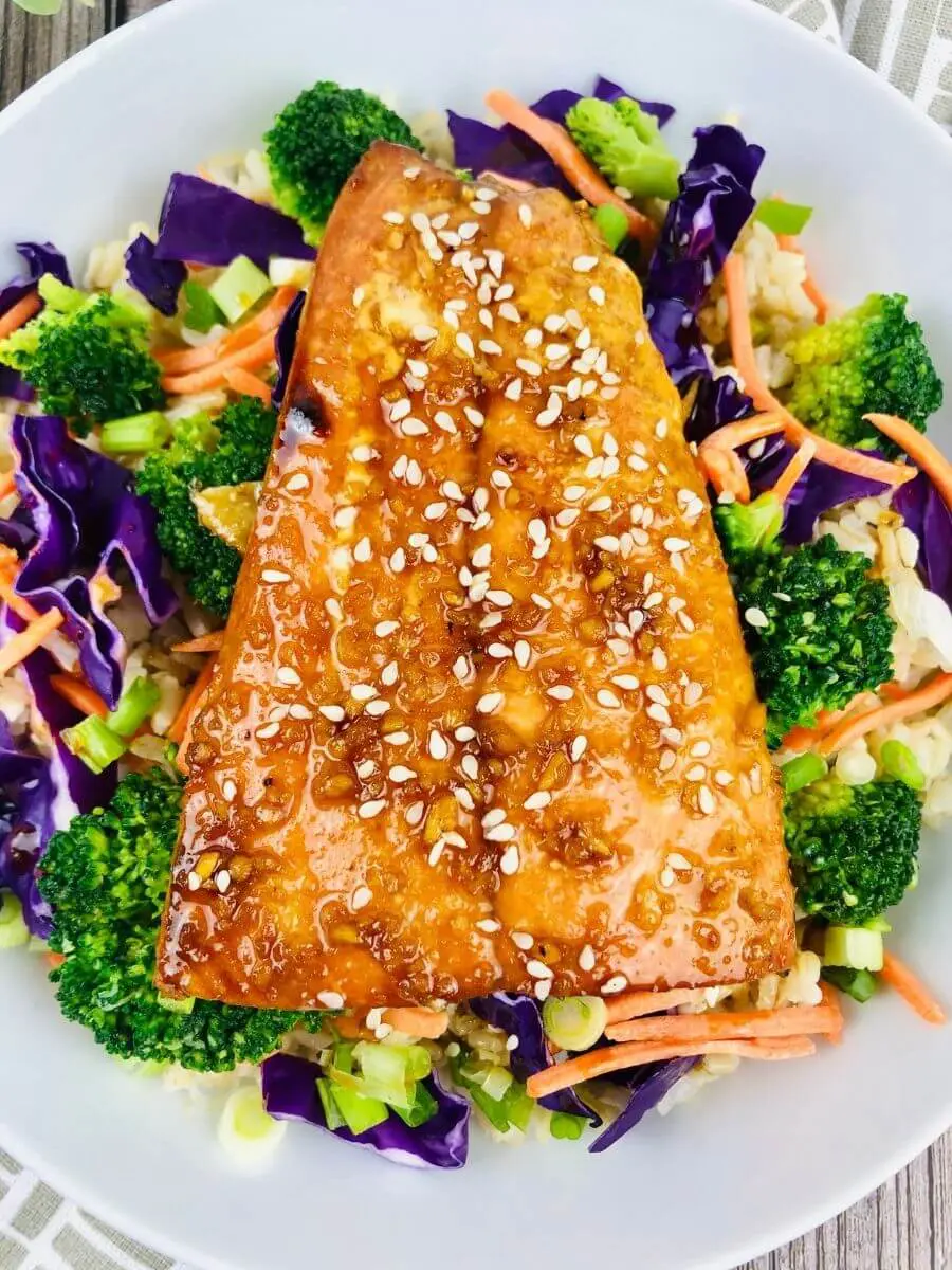 Close up of Teriyaki Salmon Bowl with sesame seed topped salmon and veggies.