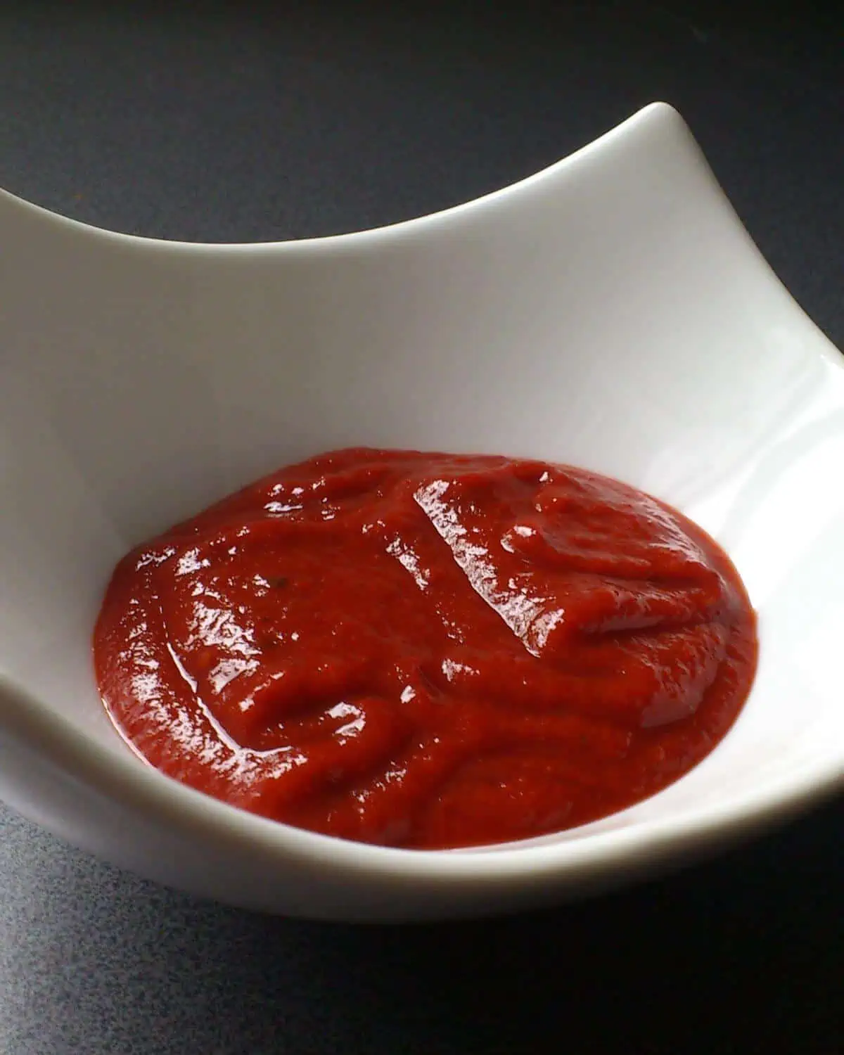 A white bowl filled with gochujang.