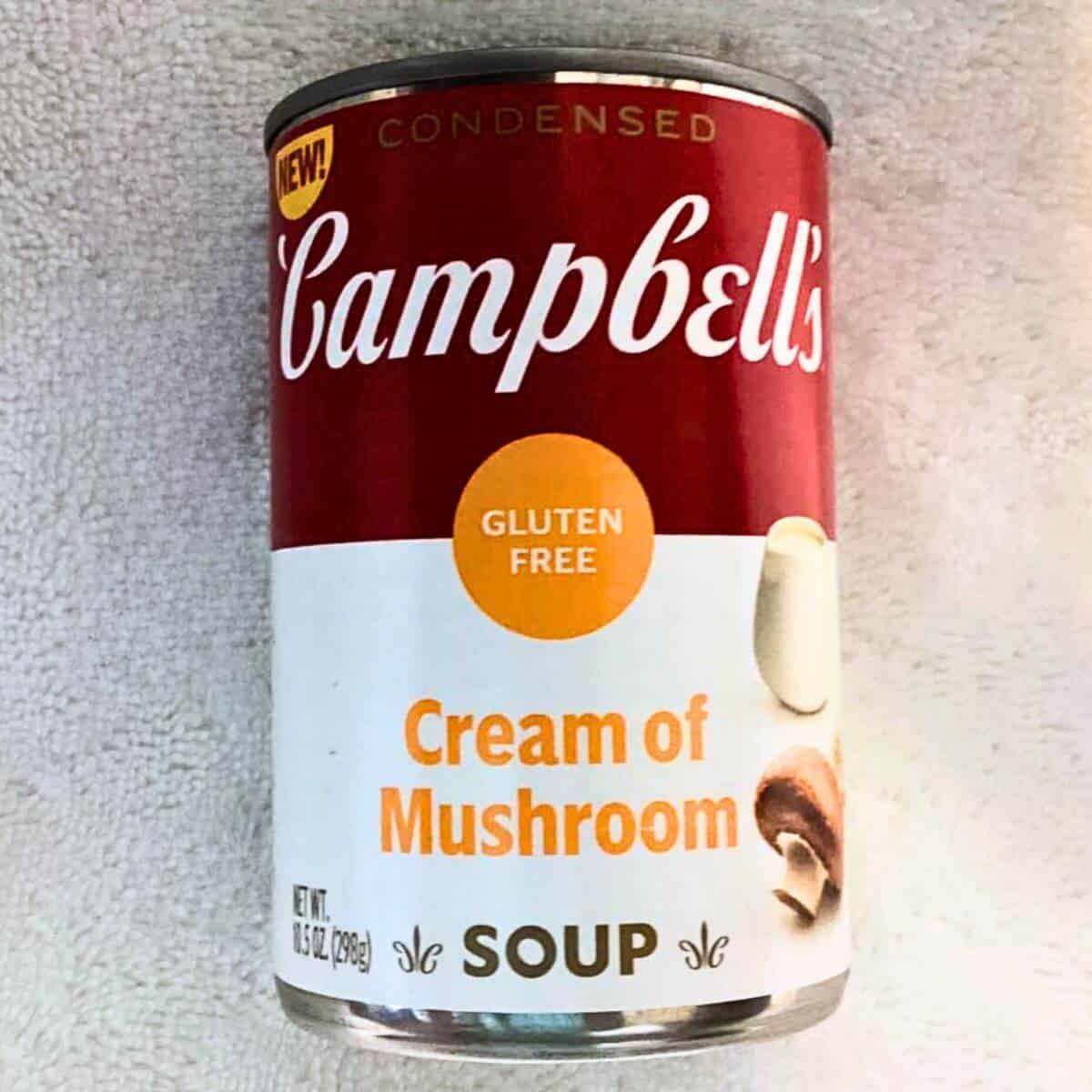 A can of campbell's gluten free cream of mushroom soup.