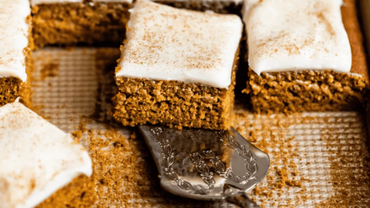 A pan of pumpkin bars with cream cheese frosting.