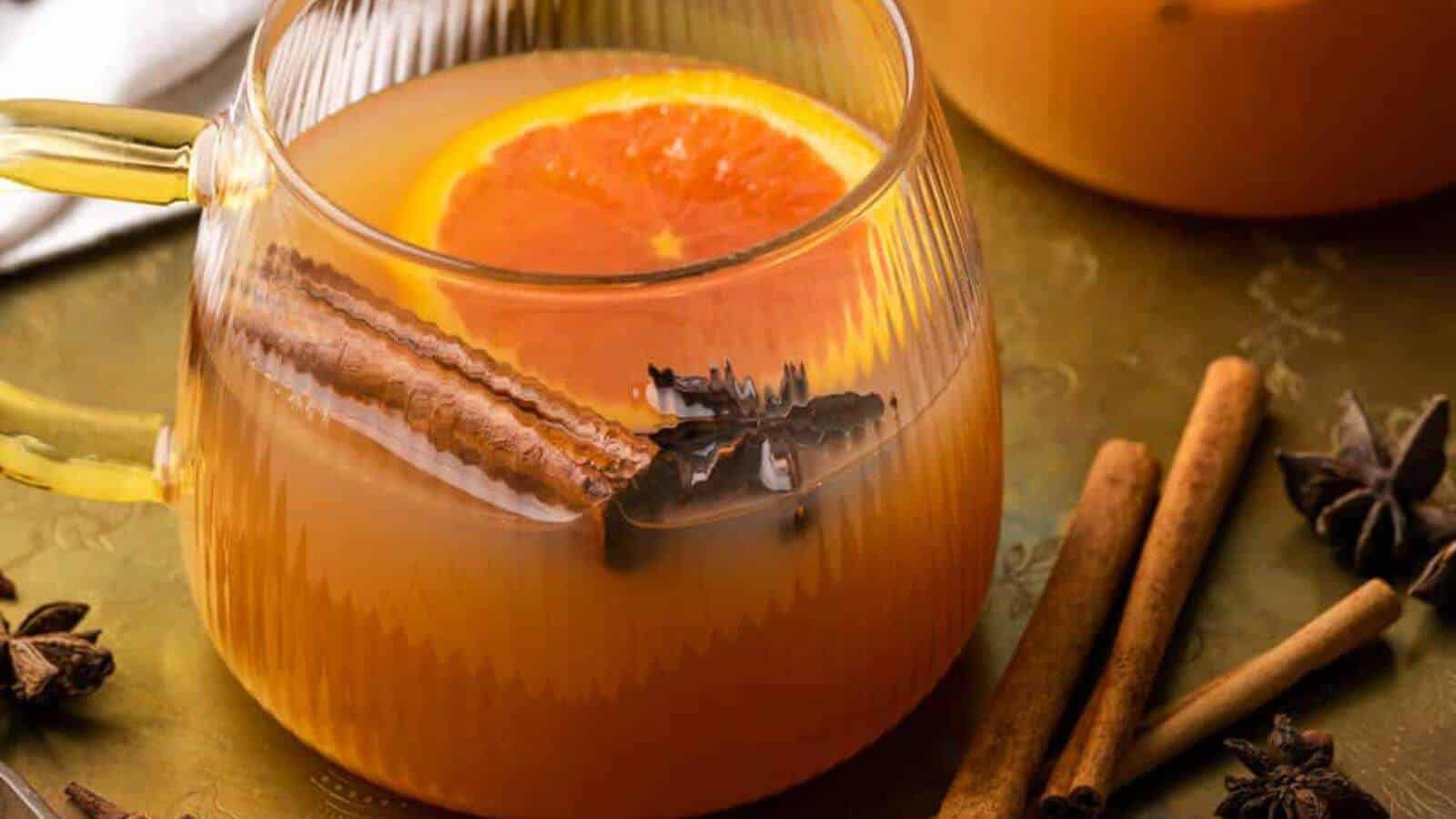 Mulled cider with an orange slice, cinnamon stick and star anise.