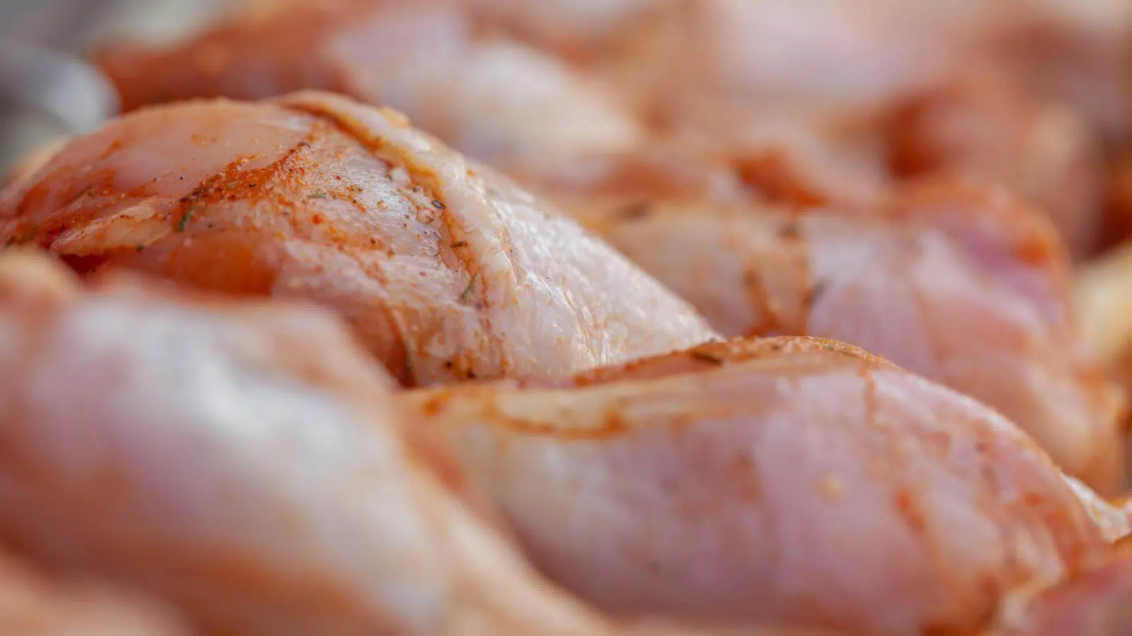 Raw chicken that has been seasoned.