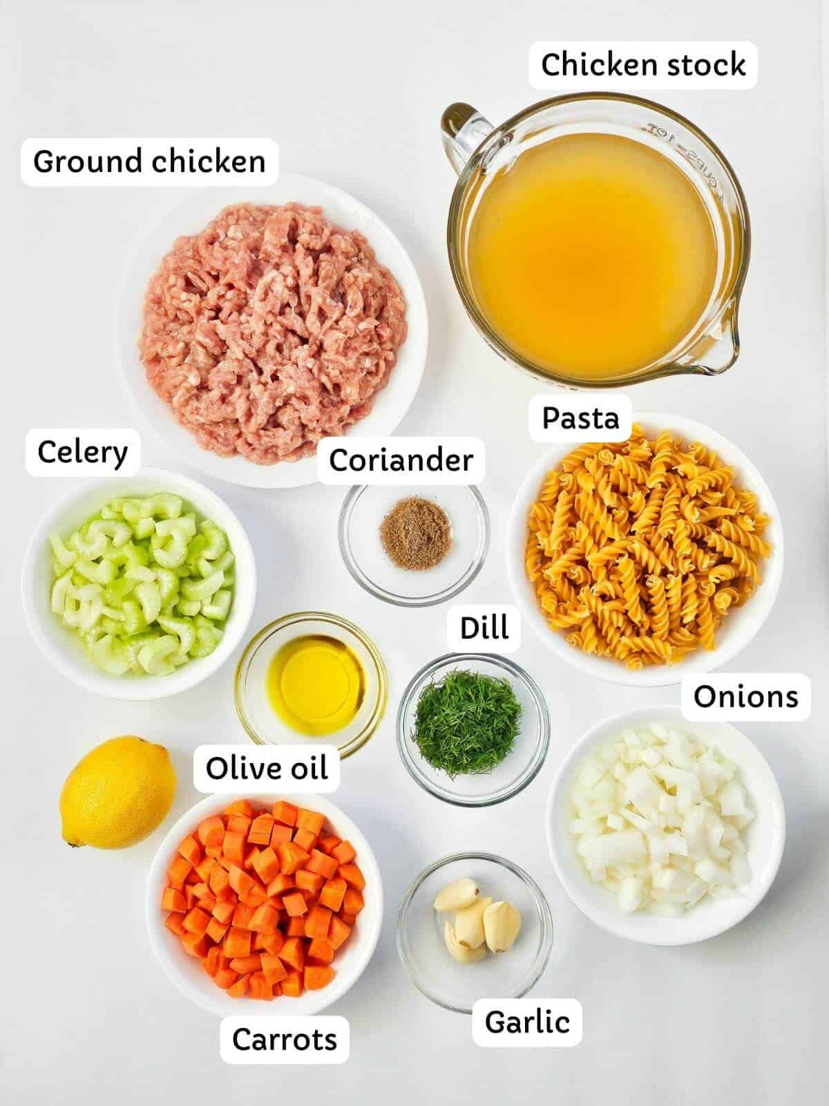 Ingredients for making ground chicken soup in small bowls.