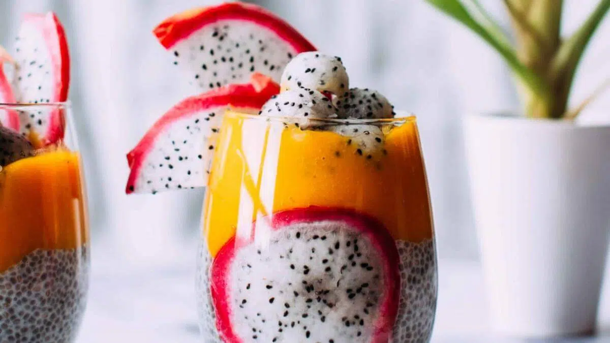 Dragonfruit and mango chia seed pudding in a glass.