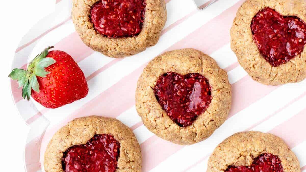 Cookies with heart shaped jam in the middle.