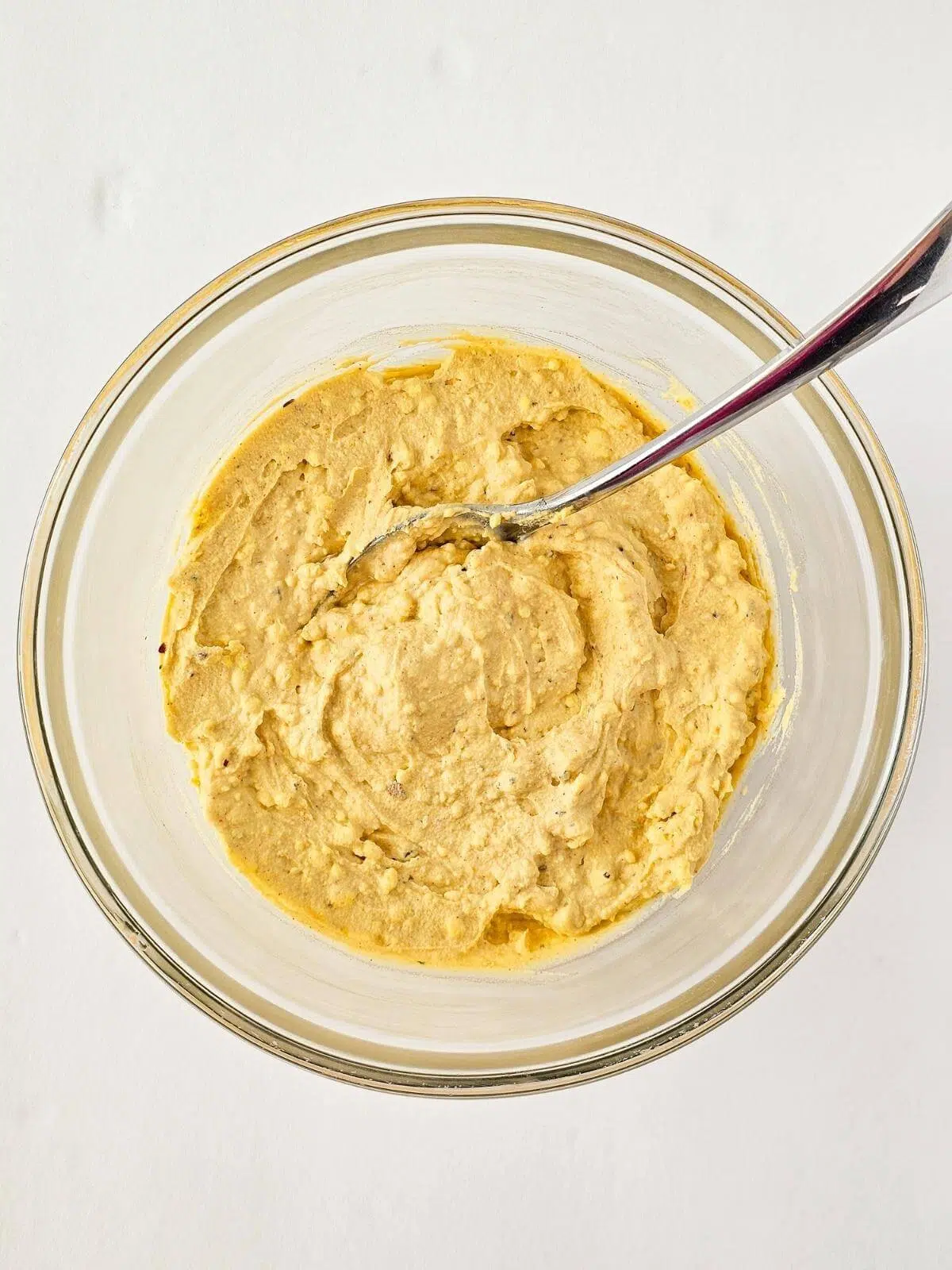 The filling for Cajun deviled eggs in a glass bowl.