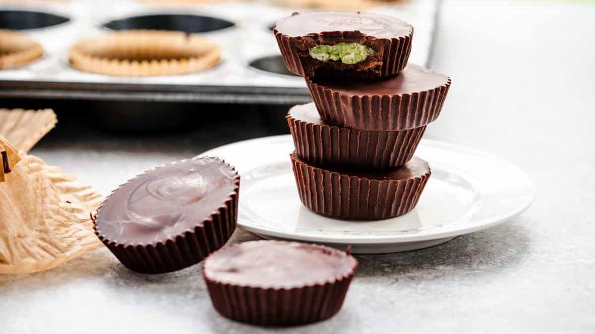 A stack of chocolate mint cups on a plate.