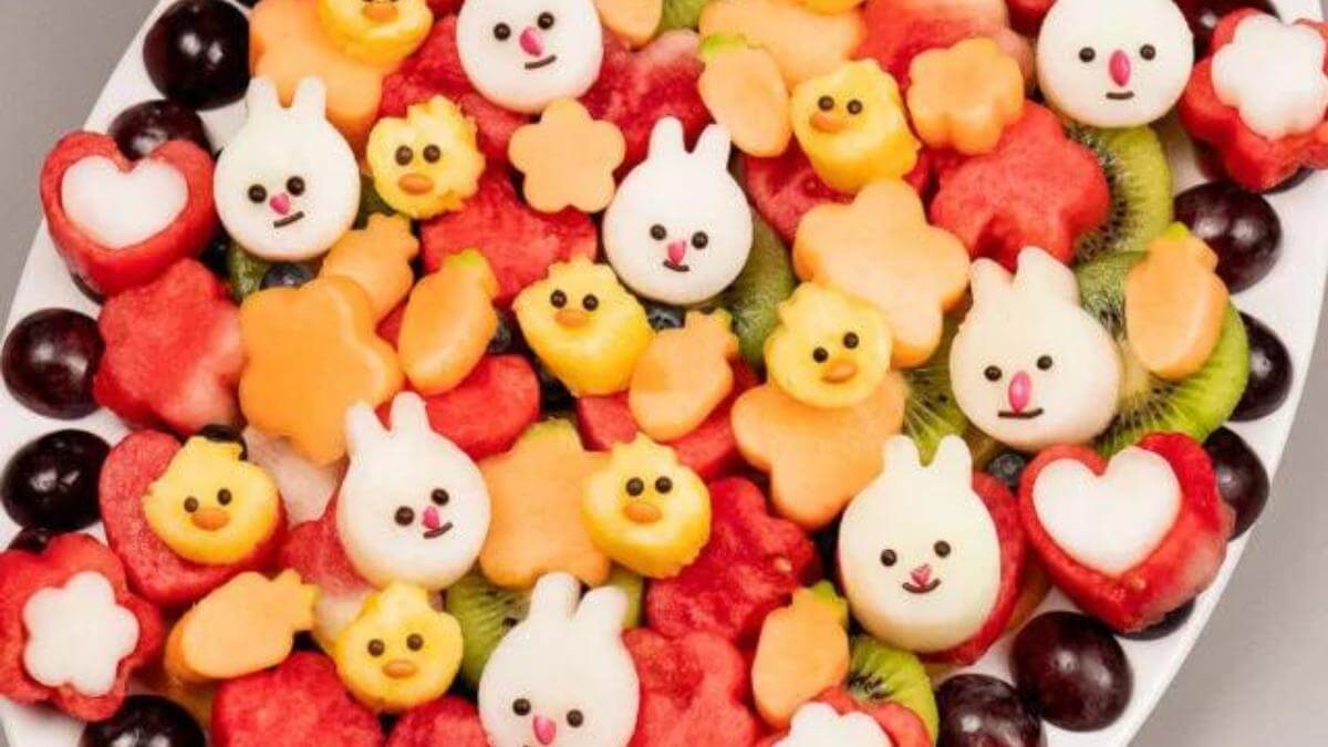 An Easter fruit platter with fruits shaped like bunnies and chicks.