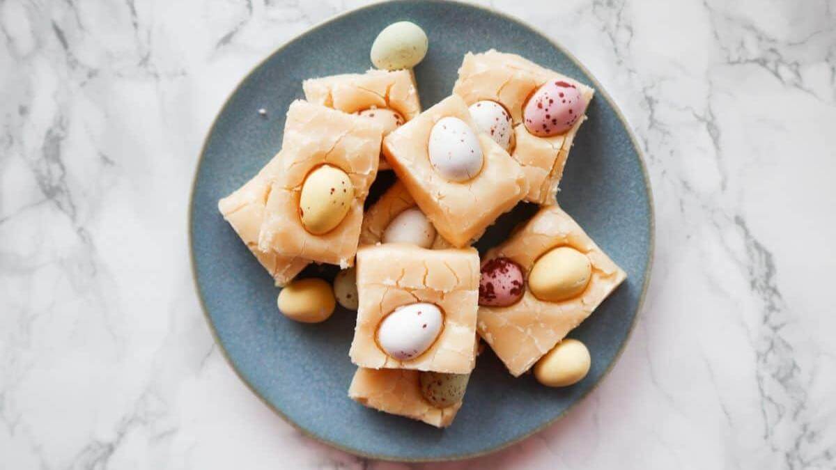 Pieces of mini Easter egg fudge on a plate.