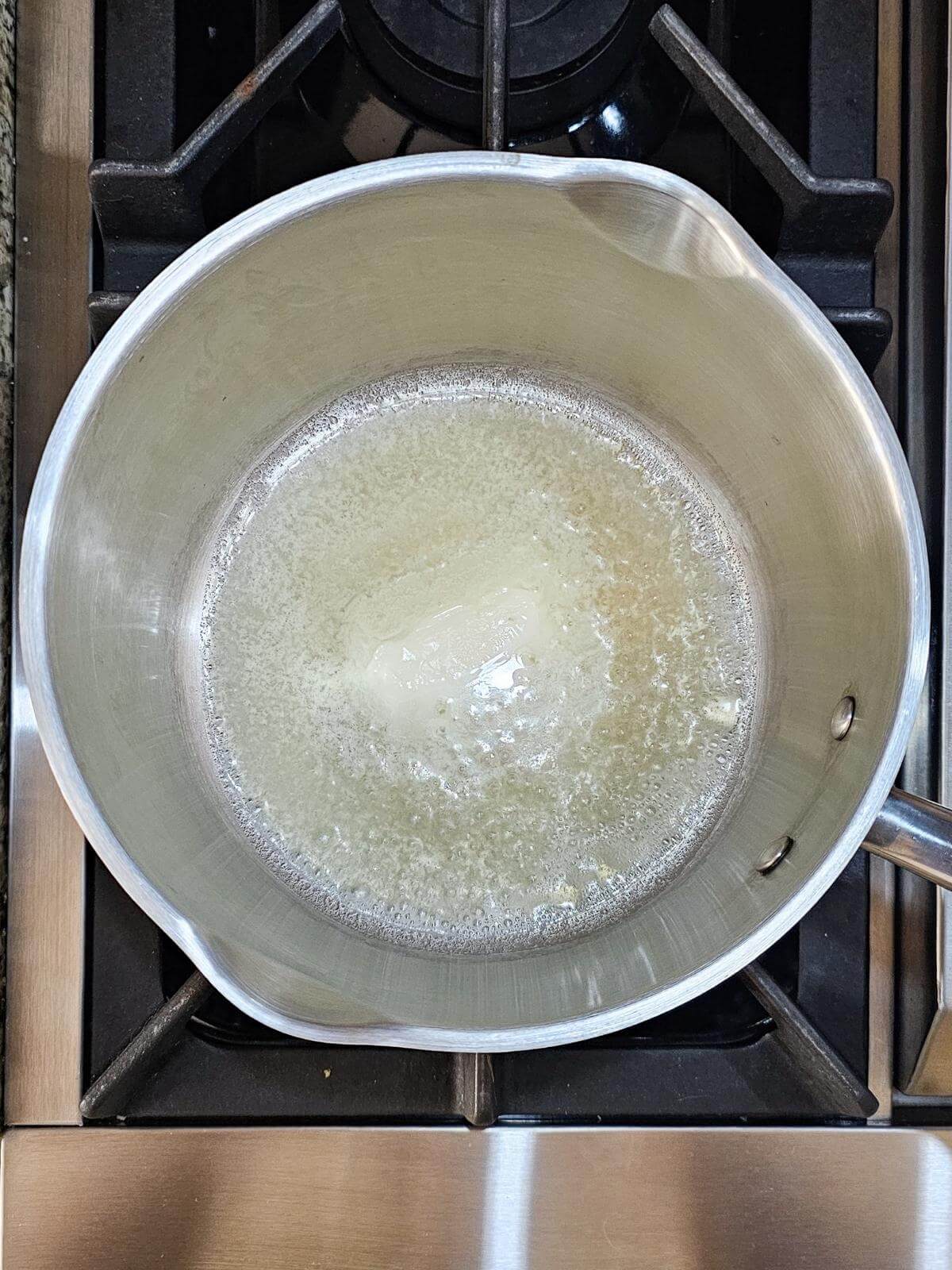 Melted butter in a pot.