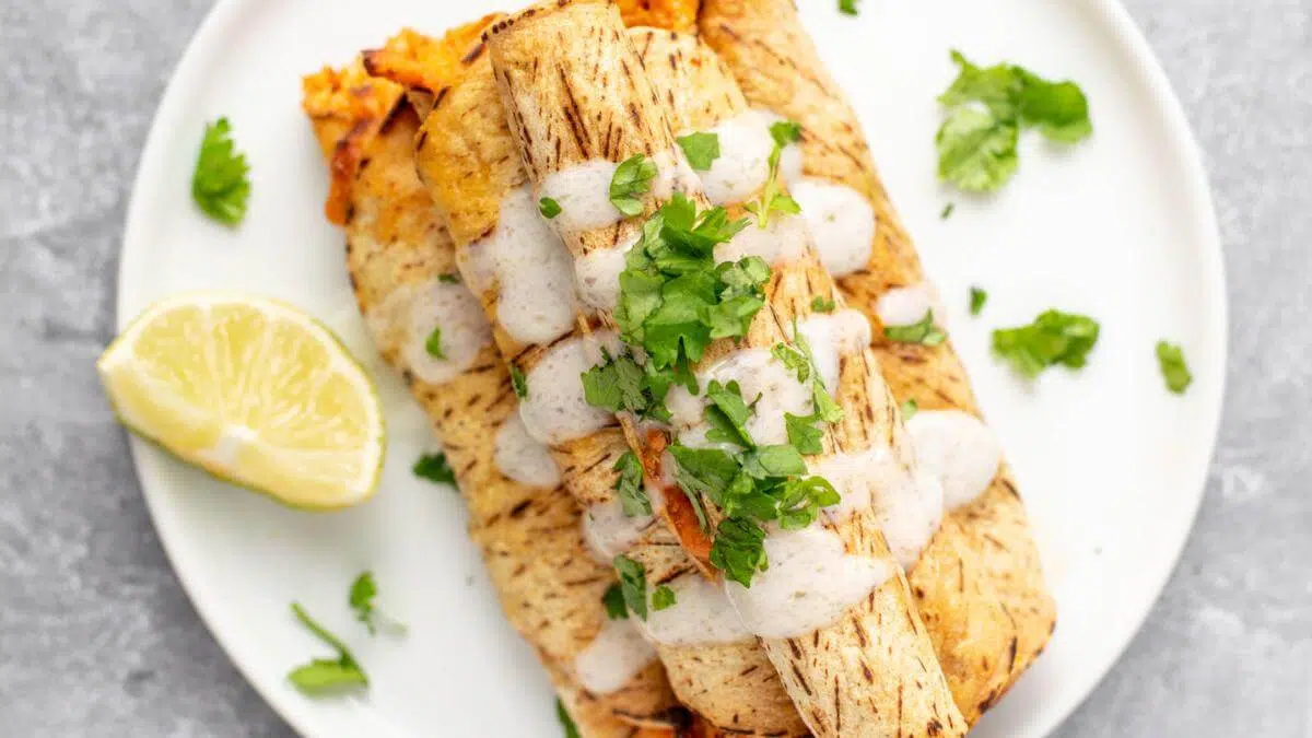 Chicken taquitos on a plate.