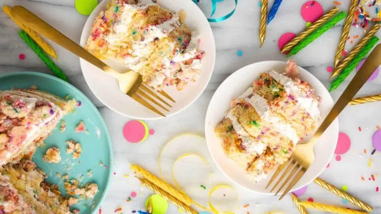 Slices of birthday cake on plates.