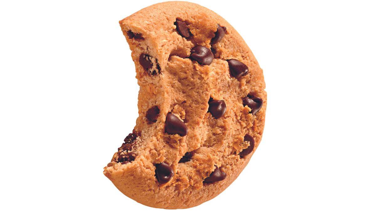 A gluten free Chips Ahoy! cookie with a bite taken out of it.