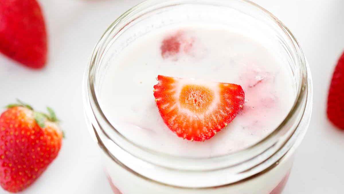 A glass jar of rhubarb panna cotta.