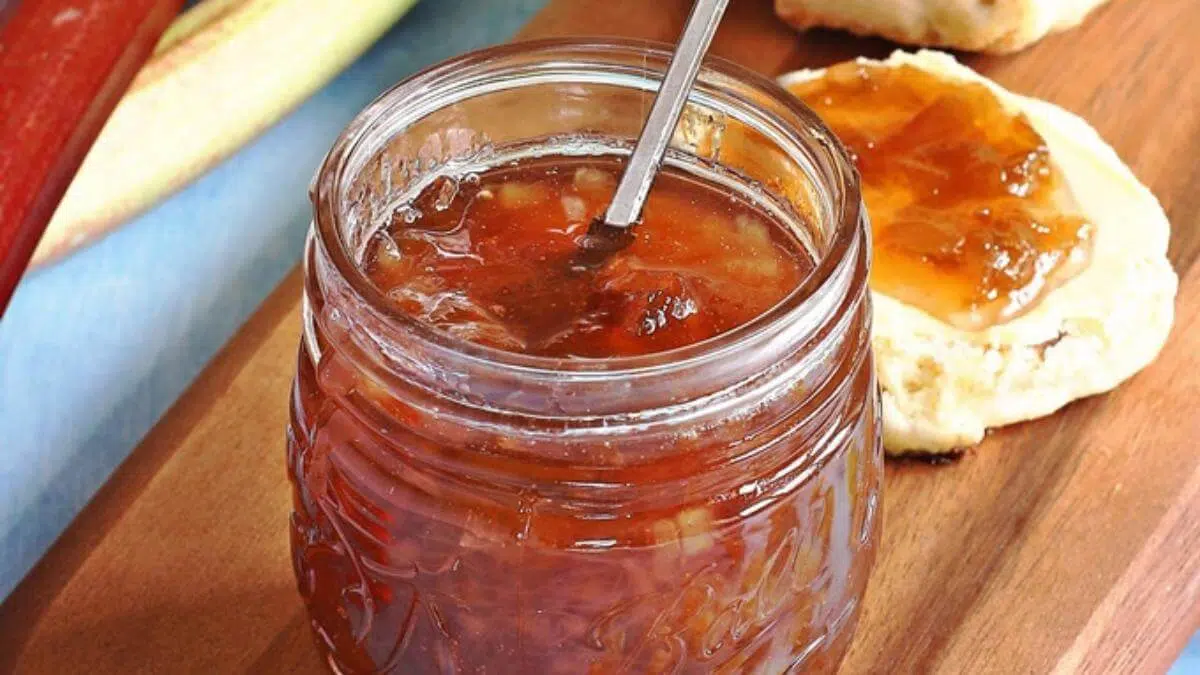 A glass jar of rhubarb jam.