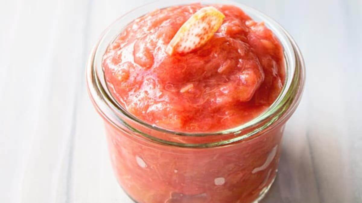A glass jar of rhubarb sauce.