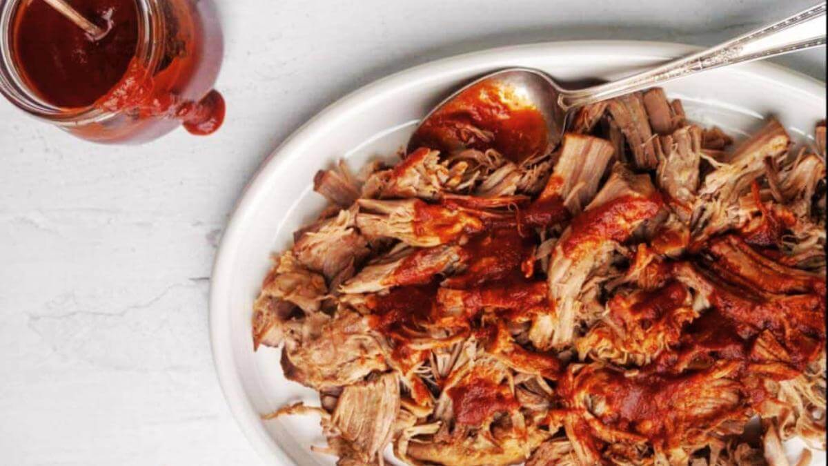 Slow cooker pulled pork on a plate.