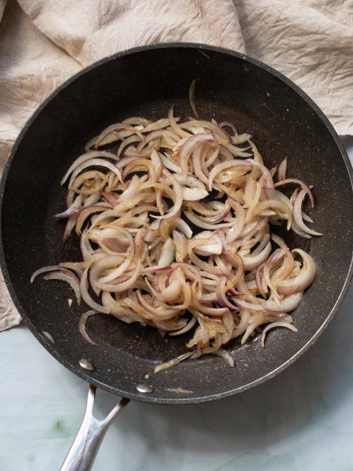 Onions and garlic in a skillet.