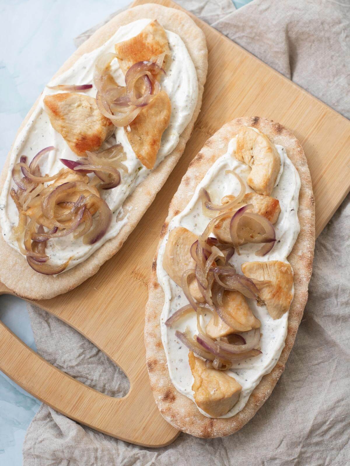 Pita breads with toppings.