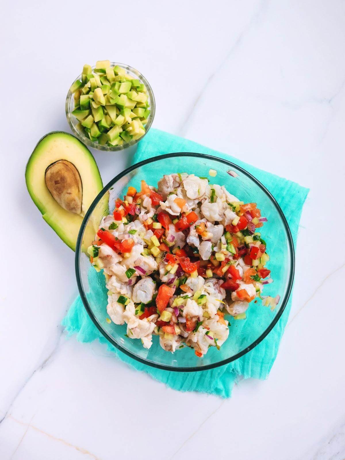 Shrimp and chopped veggies in a bowl.