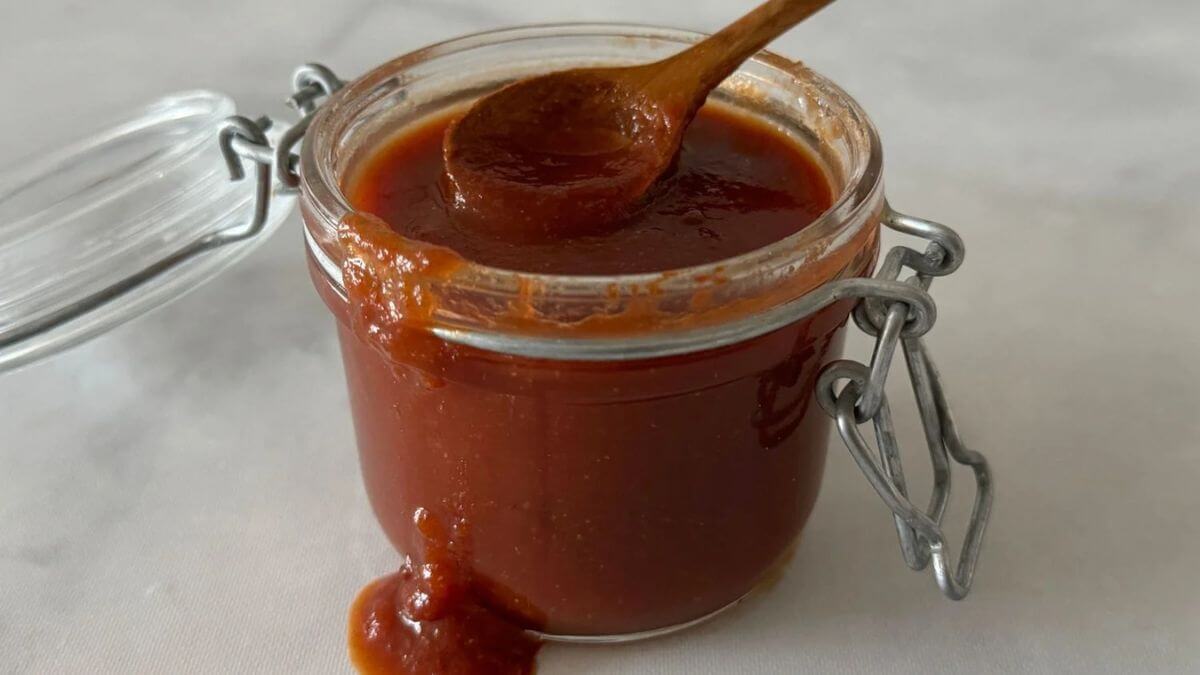 Bbq sauce in a glass jar.