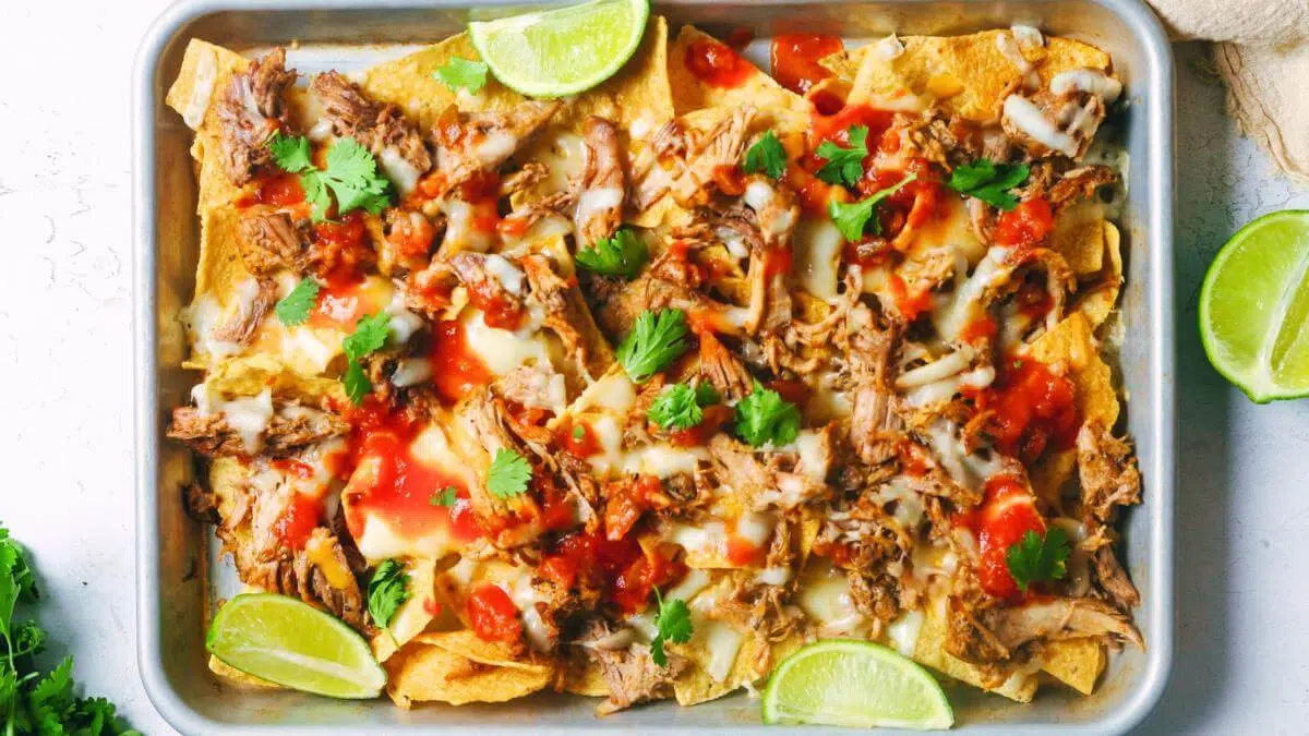 BBQ pork nachos on a tray.