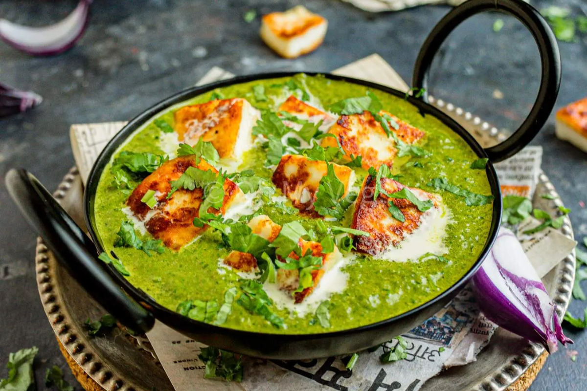 Palek paneer in a skillet.