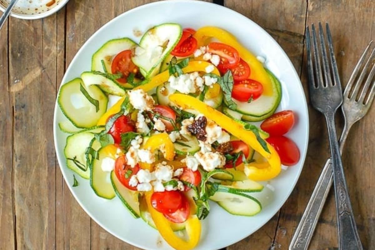 Mediterranean zucchini ribbons salad on a plate.