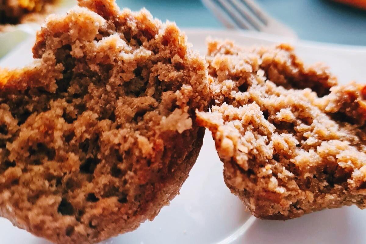 A spiced persimmon muffin cut in half.