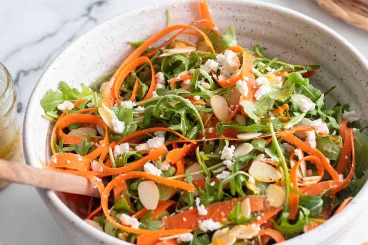 A carrot ribbon salad with arugula. 