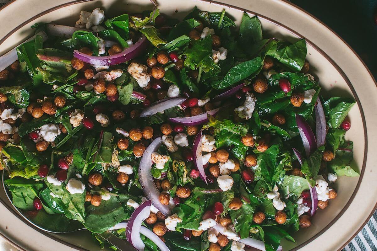 Roasted chickpea, pomegranate, and goat cheese salad with pomegranate vinaigrette.