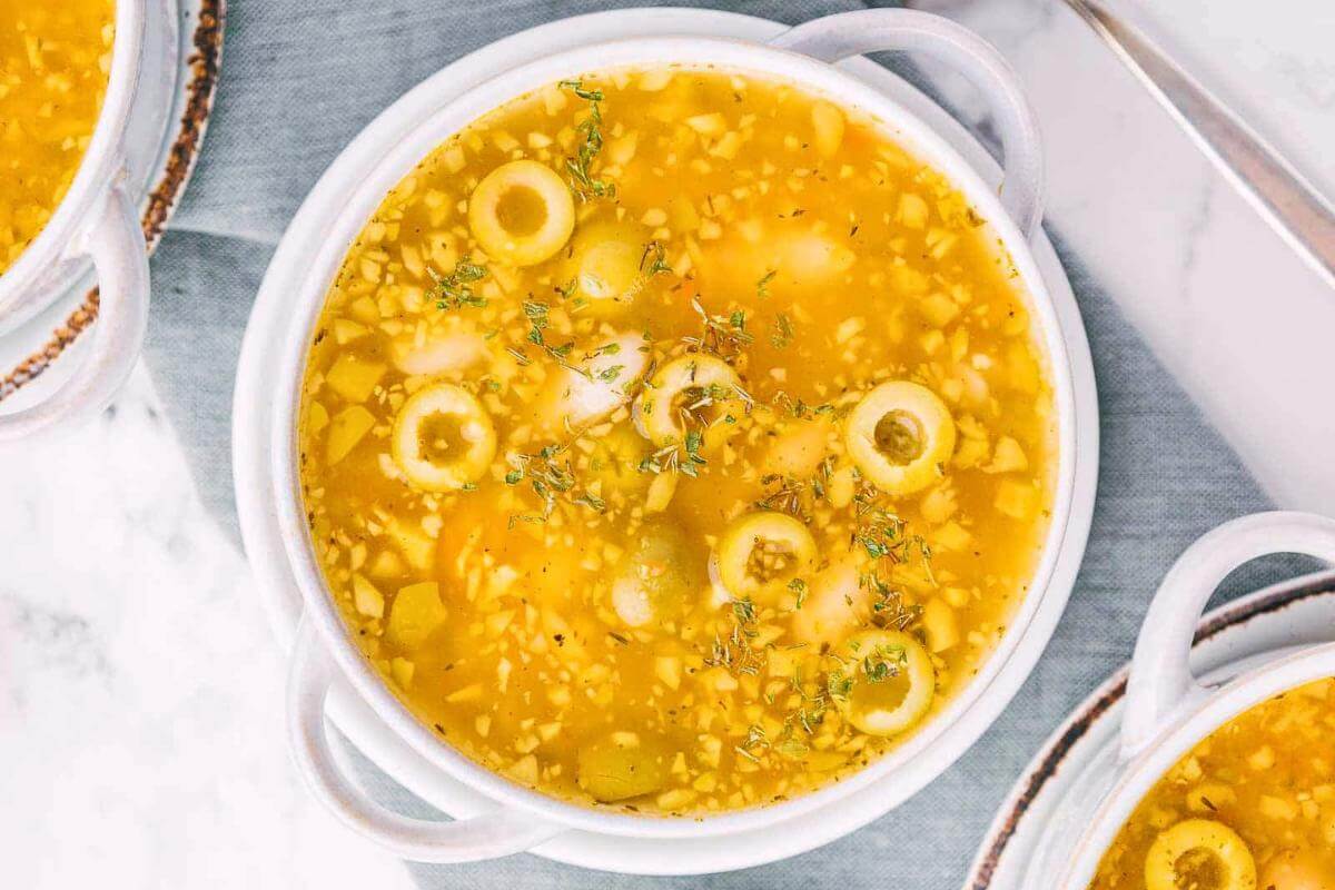 A bowl of green olive soup.