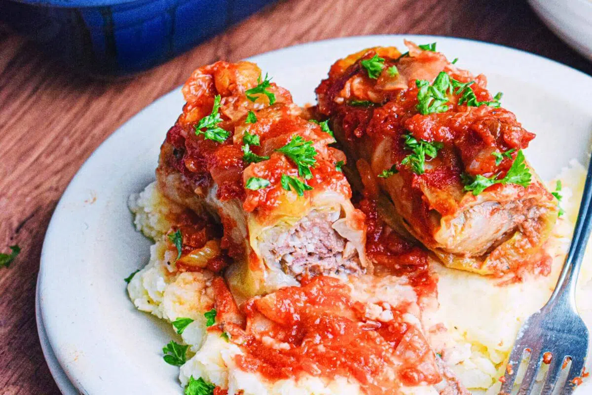 Beef stuffed cabbage rolls on a plate.