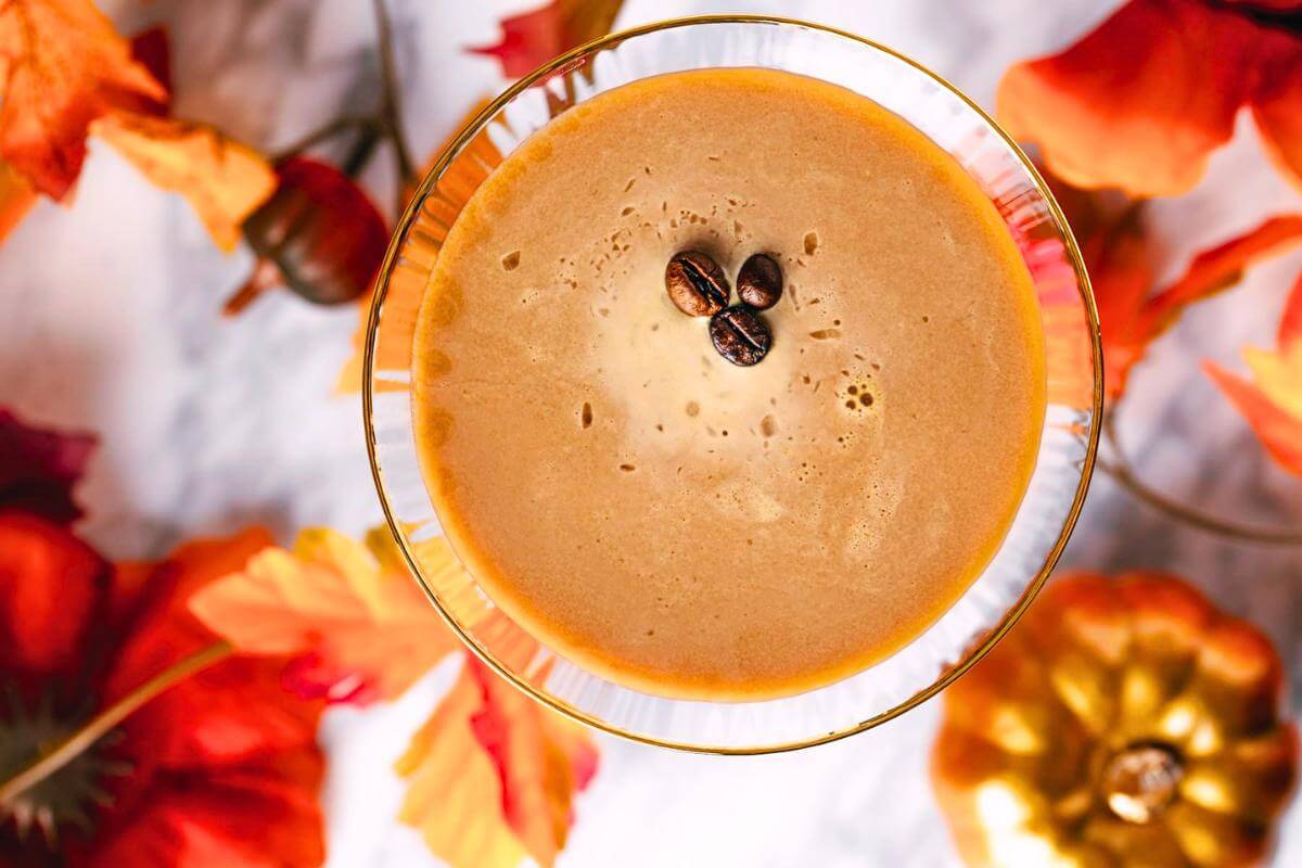 A pumpkin spice espresso martini in a glass.