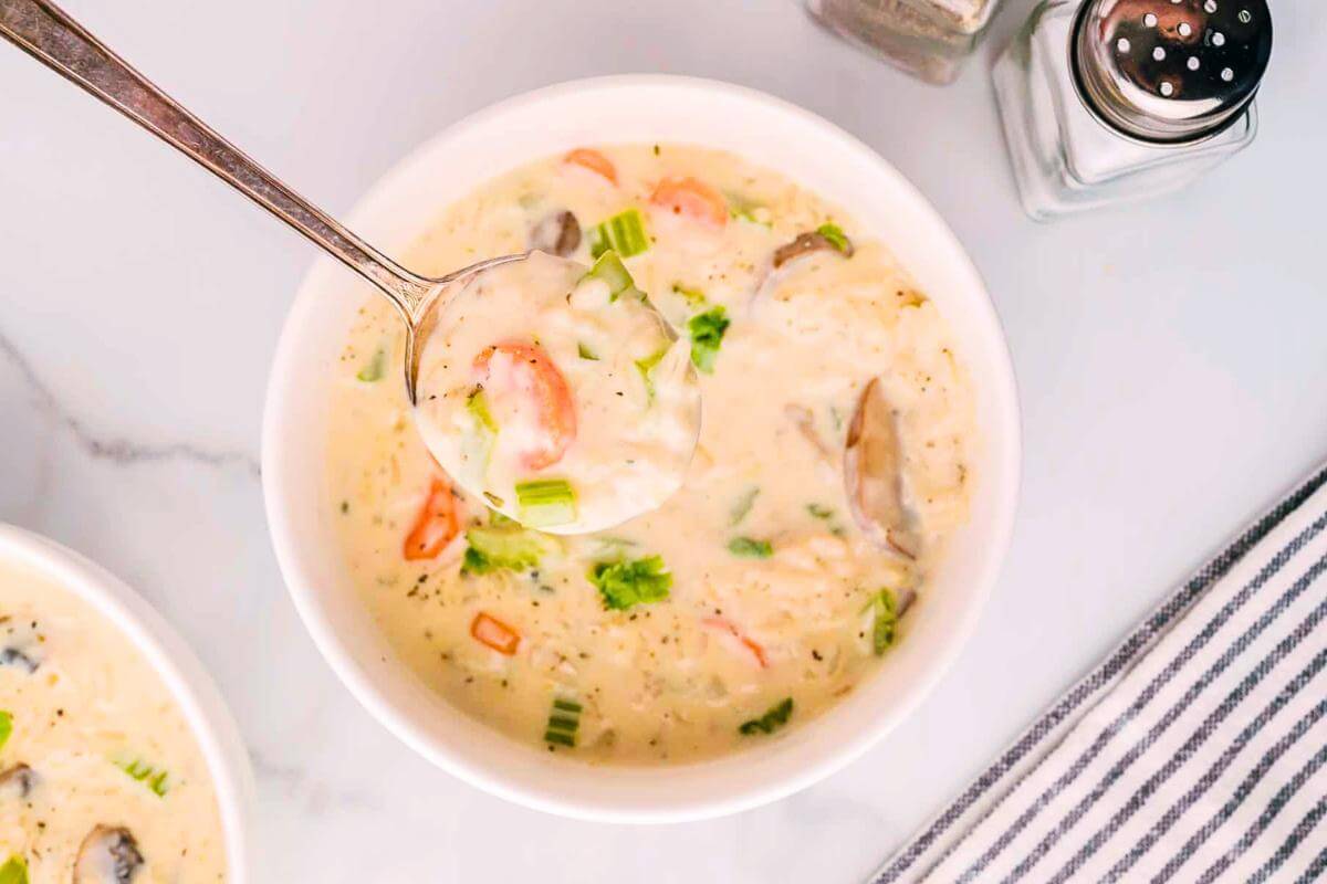 A bowl of mushroom and rice soup.