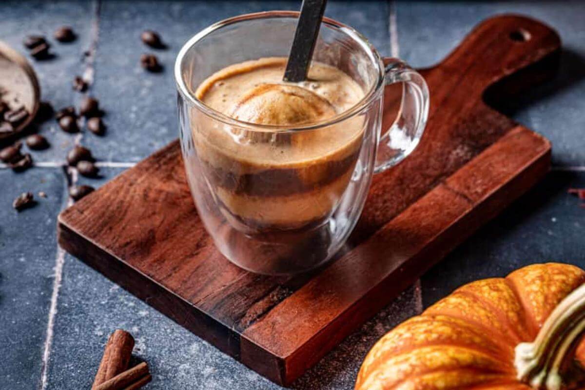 A pumpkin spice Affogato in a glass mug.