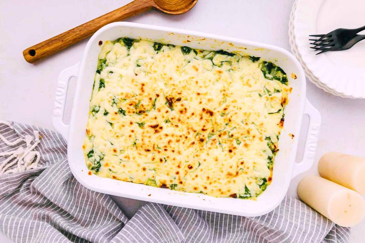 Creamy spinach dip in a baking dish.