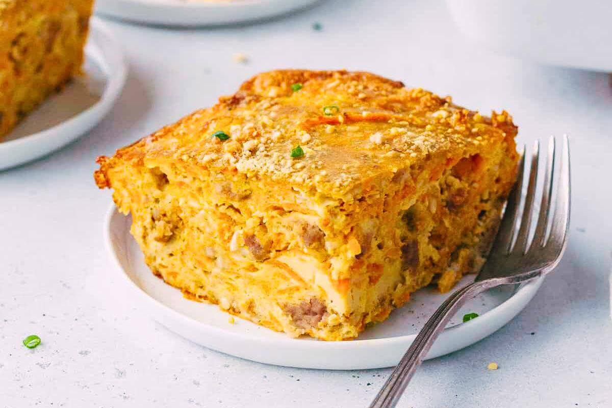 A slice of breakfast casserole on a plate.