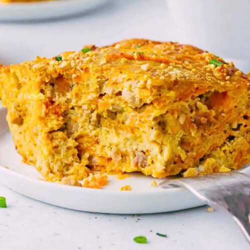 A slice of breakfast casserole on a plate.