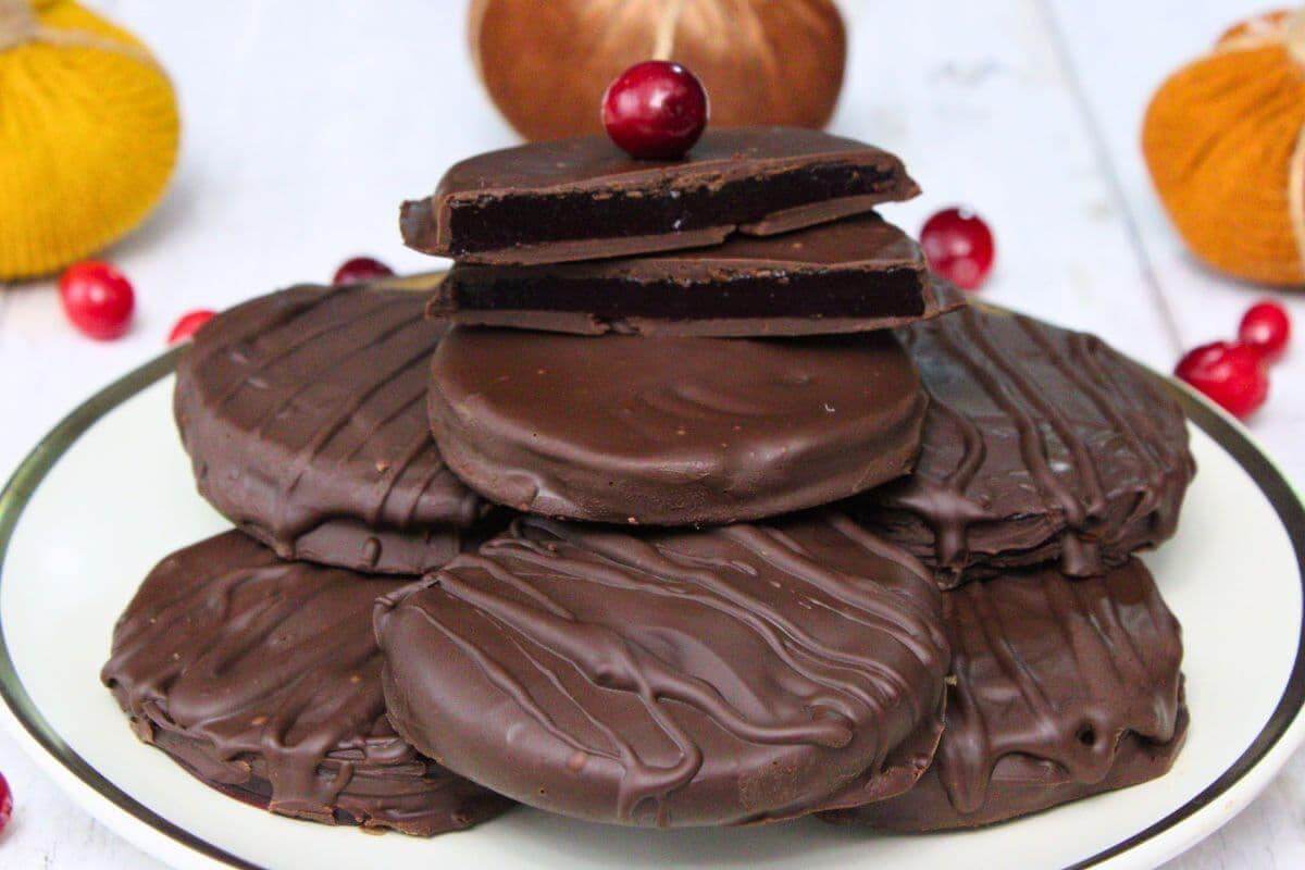 Chocolate covered cranberry sauce on a plate.