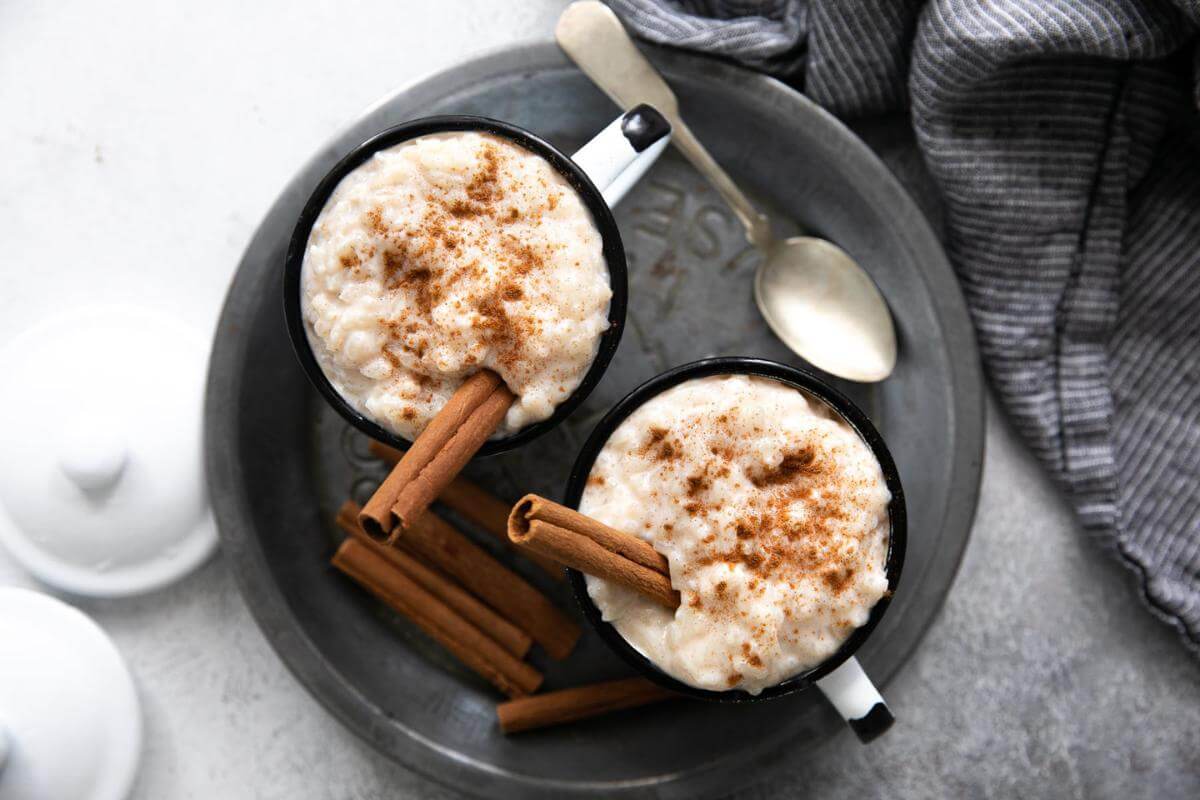 Two mugs with Mexican rice pudding.