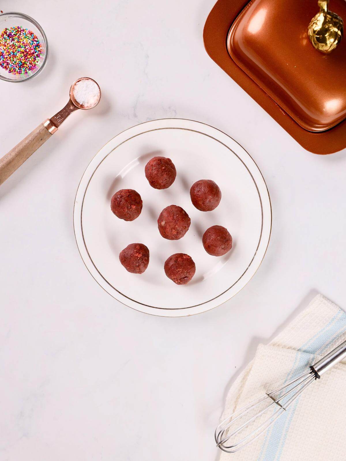 A plate of red velvet cake balls.