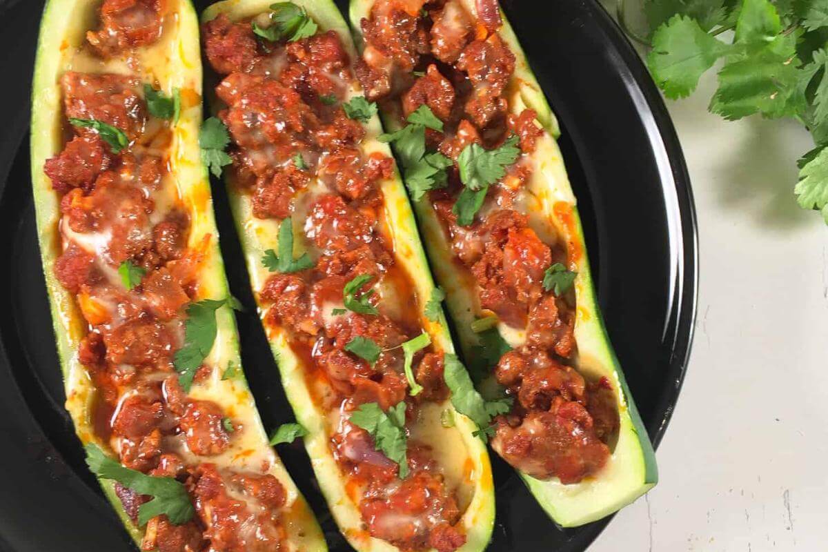 Chorizo stuffed zucchini boats.