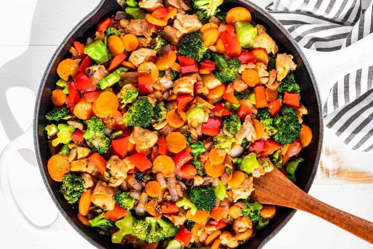 Honey garlic chicken stir fry in a skillet.