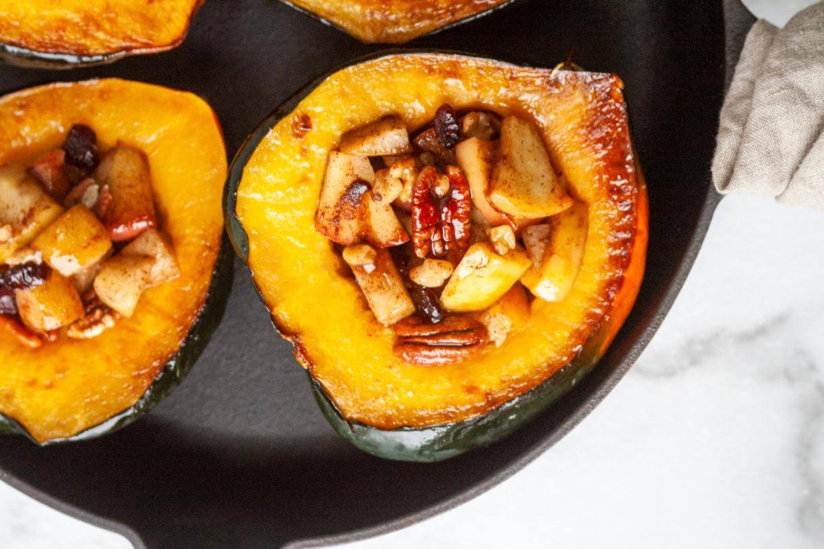 Stuffed acorn squash on a plate.