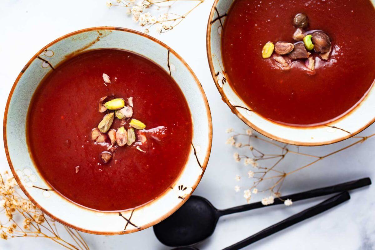 Two bowls of bone broth turmeric soup.