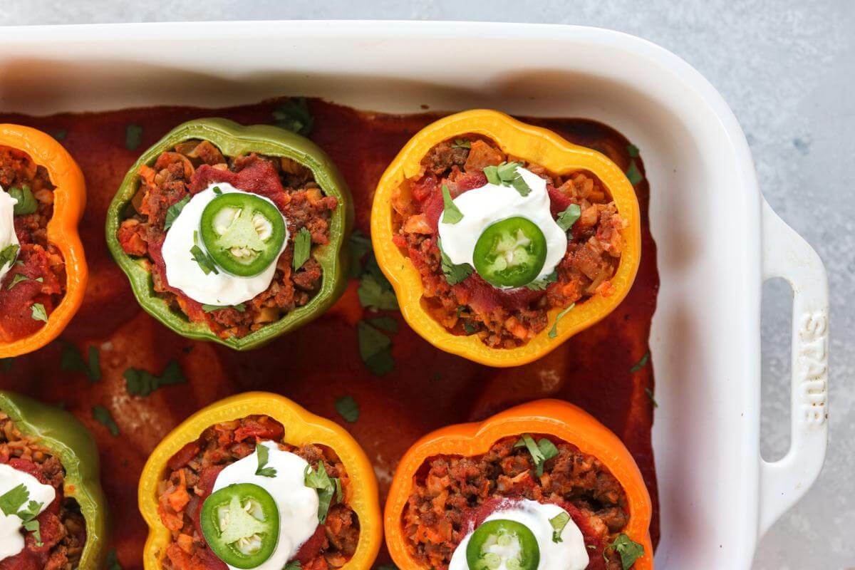 Stuffed peppers in a baking dish.