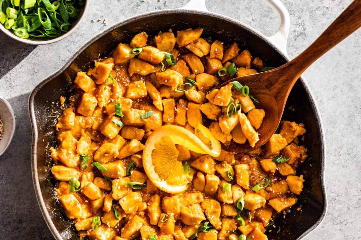 Orange chicken in a skillet.